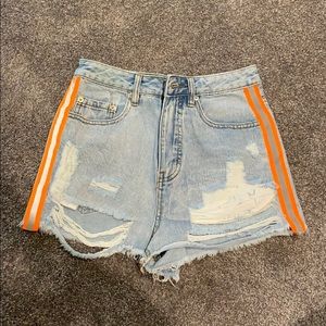 Jean shorts with orange stripe on side